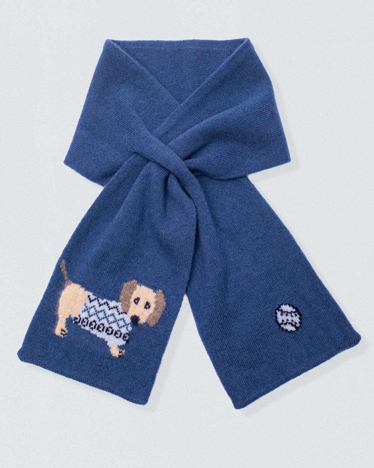 Blue scarf with embroidered dog design on a light gray background