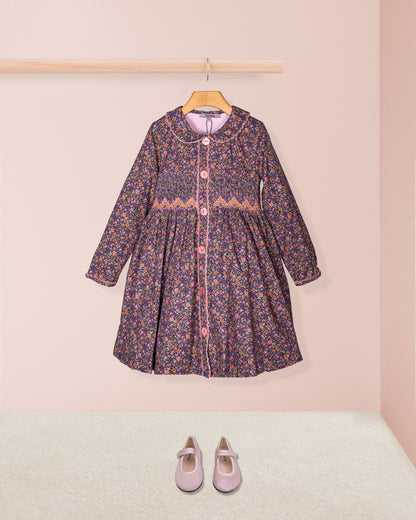 Floral dress with pink shoes on a light pink background