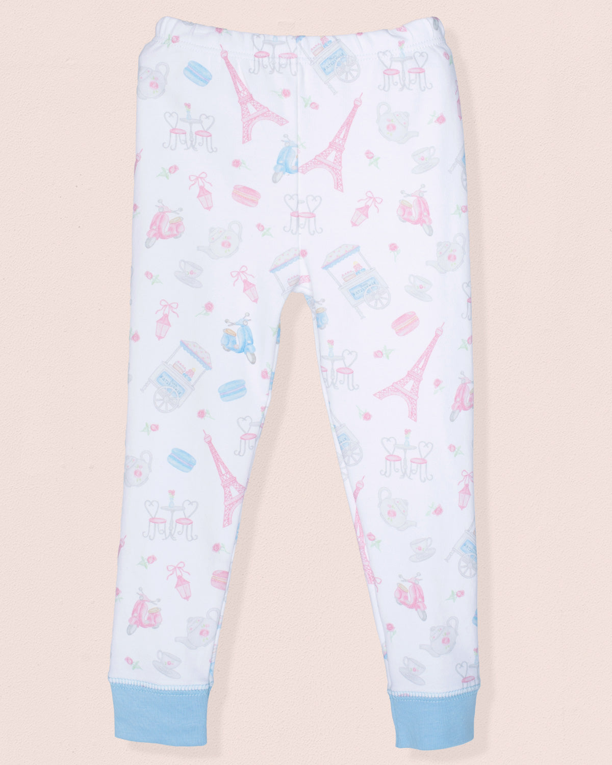 Light blue pajama pants with Eiffel Tower and ice cream print on a beige background