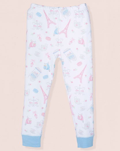 Light blue pajama pants with Eiffel Tower and ice cream print on a beige background
