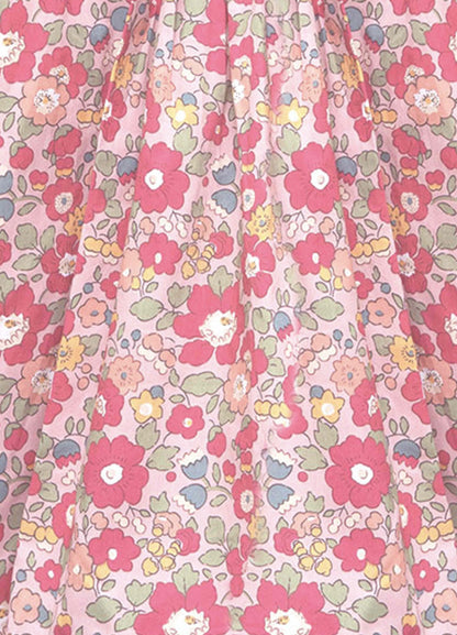 Floral patterned fabric with pink flowers on a pink background