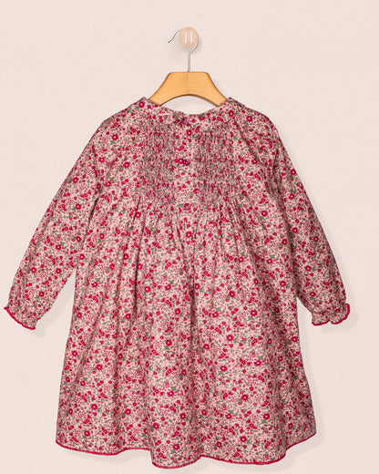 Back view of the Elizabeth Mini Mauve Floral Twill Dress, highlighting the smocked back detailing and concealed zipper.