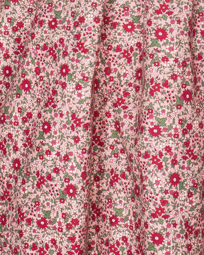 Close-up detail of the hand-smocked bodice on the Elizabeth Mini Mauve Floral Twill Dress, emphasizing fine craftsmanship and floral fabric.