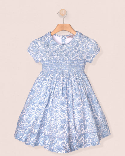 Blue floral dress on a beige background