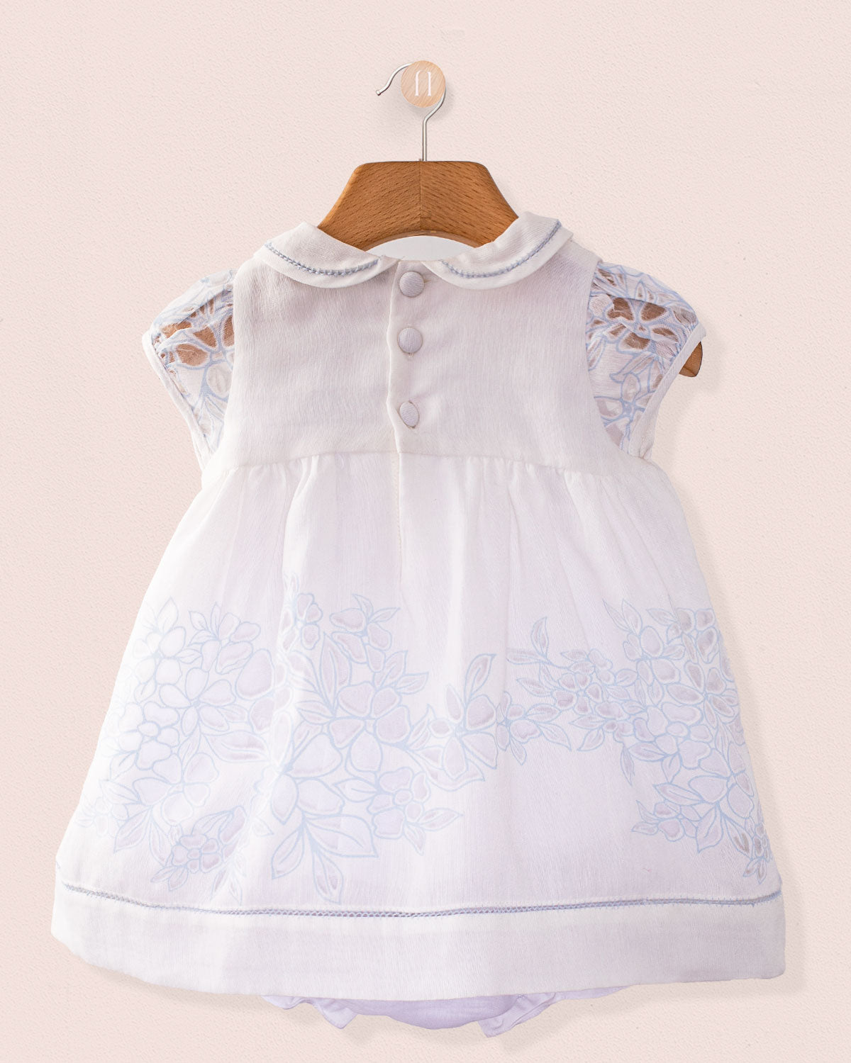 Back view of Baby Emmy Doppia Blue Smock Set highlighting pearl buttons and scalloped collar on white cotton