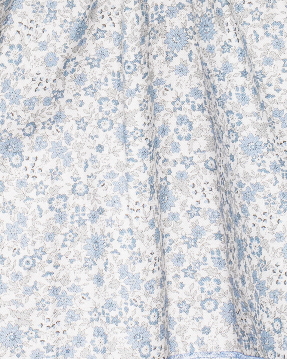 Floral patterned fabric with blue flowers on a white background