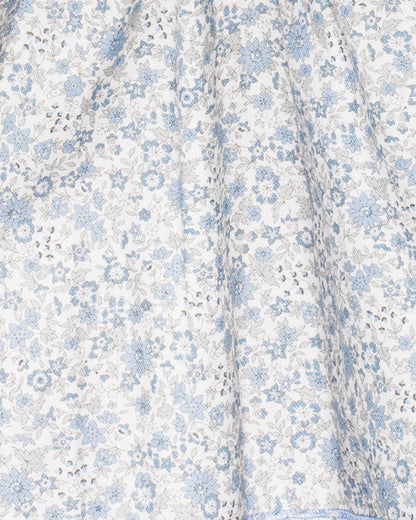 Floral patterned fabric with blue flowers on a white background