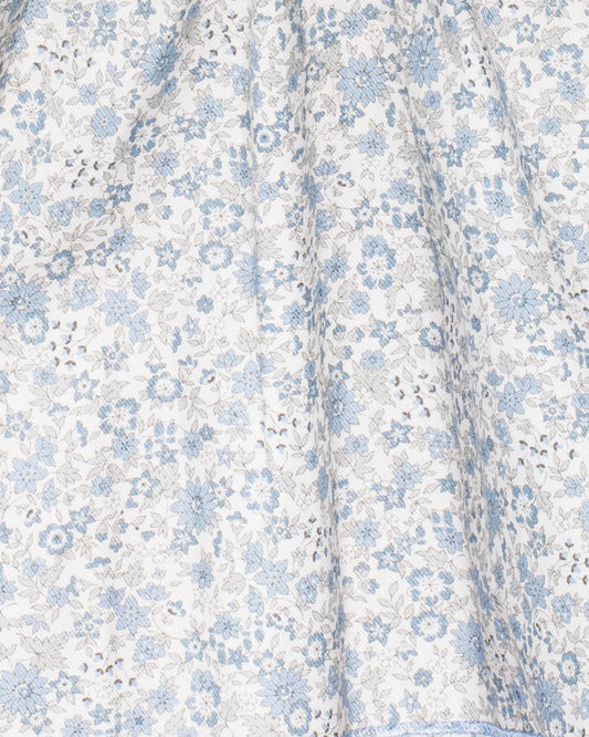 Floral patterned fabric with blue flowers on a white background