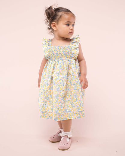 Girl walking to the front wearing Bali Liberty Meadowland Sunshine Dress showing the front of the dress 