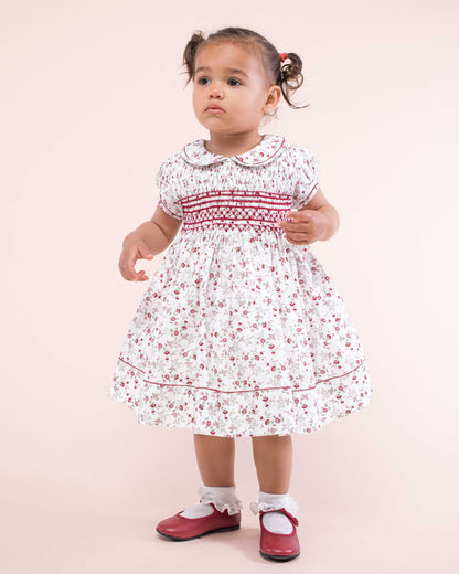 Girl wearing Emma Italian Red Floral Flannel Dress standing up showing the front of the dress