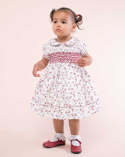 Girl wearing Emma Italian Red Floral Flannel Dress standing up showing the front of the dress