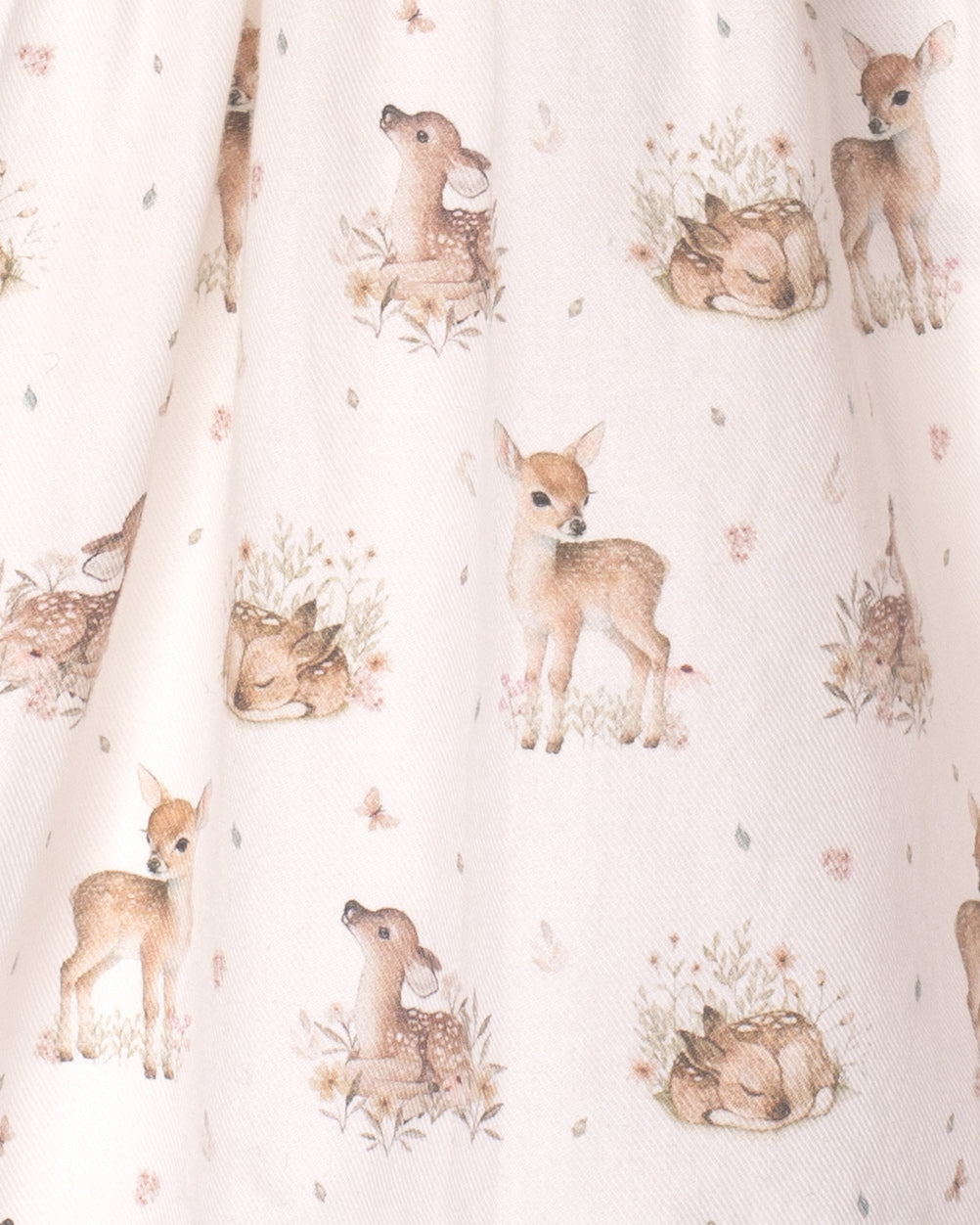 Fabric with a pattern of deer and floral elements on a white background
