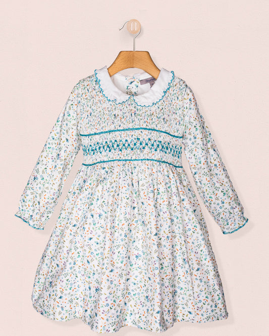 Floral dress with a white collar on a pink background