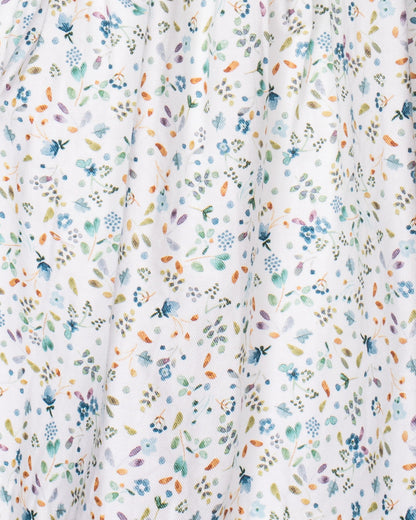 Floral patterned fabric with small flowers in various colors on a white background