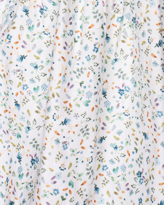 Floral patterned fabric with small flowers in various colors on a white background
