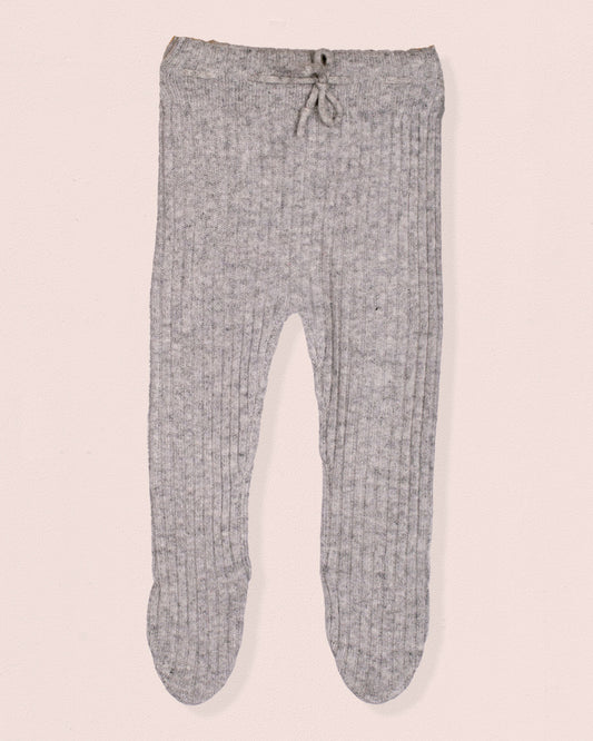 Gray baby pants on a light pink background
