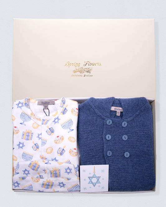 Two baby hanukkah print clothes in a box with 'Spring Flowers' branding on a light gray background