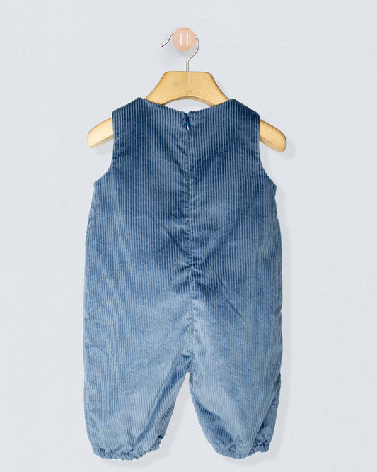 Back of blue corduroy baby romper on a hanger against a light gray background