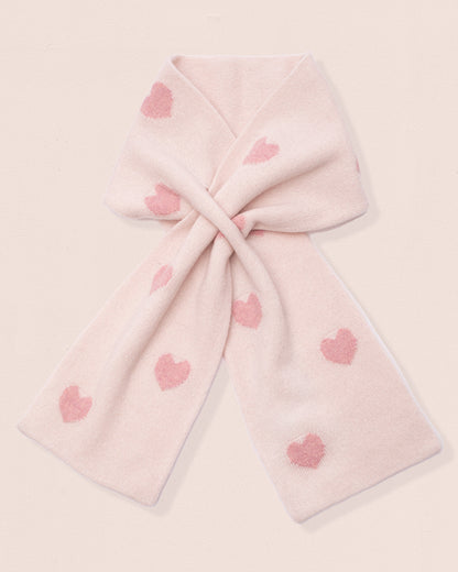 Light pink cashmere scarf with pink heart patterns on a light pink background