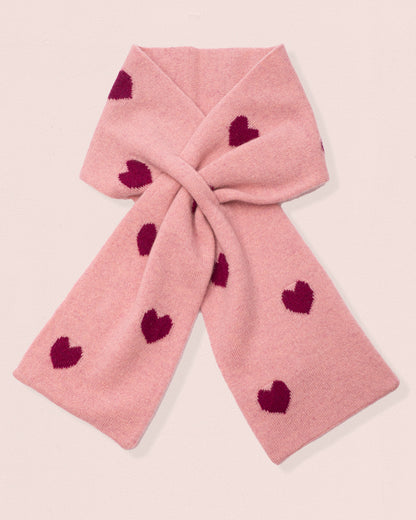 Rose-Pink colored cashmere scarf with red heart patterns on a light pink background