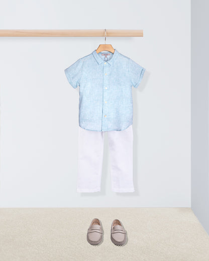 aqua shirt, white pants, and gray loafers on a white background