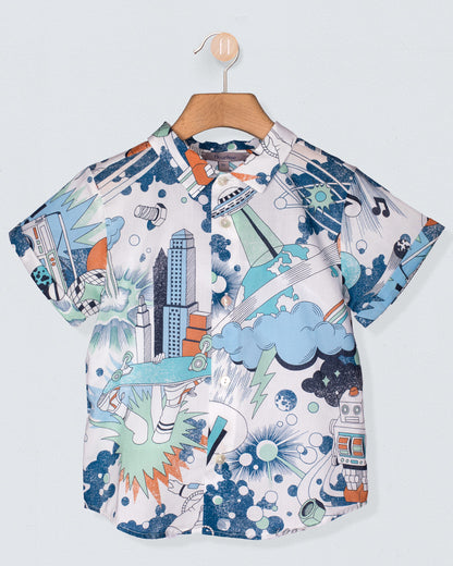 Children's shirt with space-themed design on a hanger against a light blue background