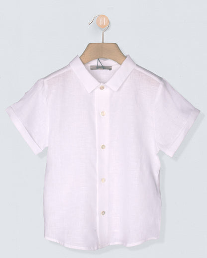 white short-sleeve shirt on a hanger against a light gray background