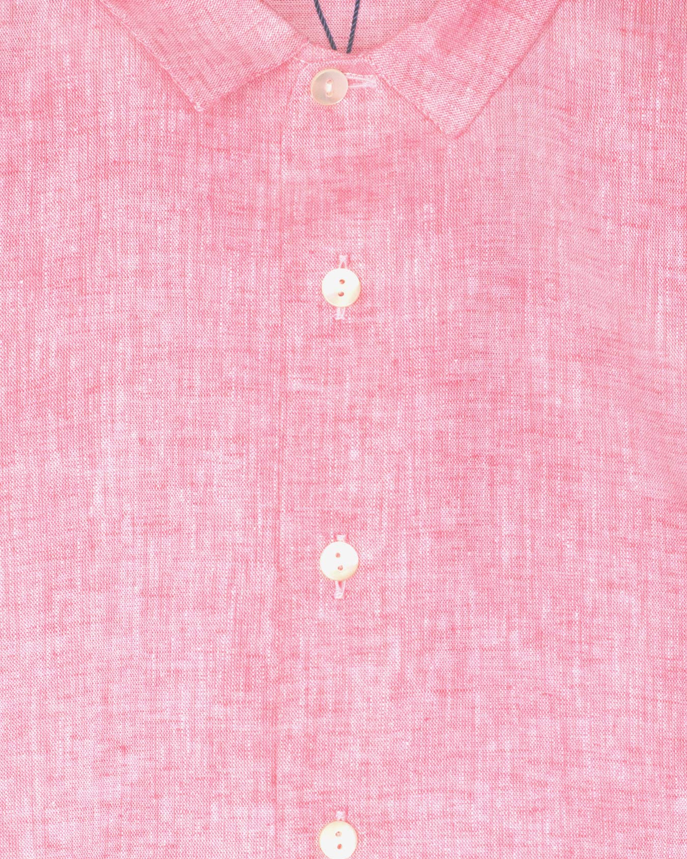 Close-up of a pink textured shirt with buttons