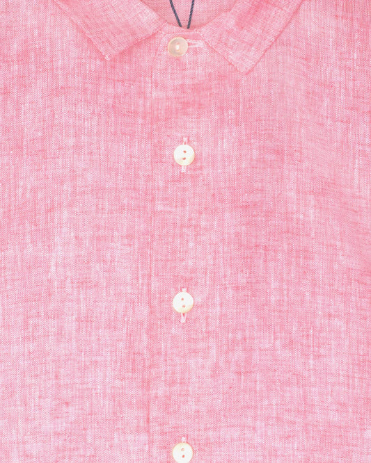 Close-up of a pink textured shirt with buttons