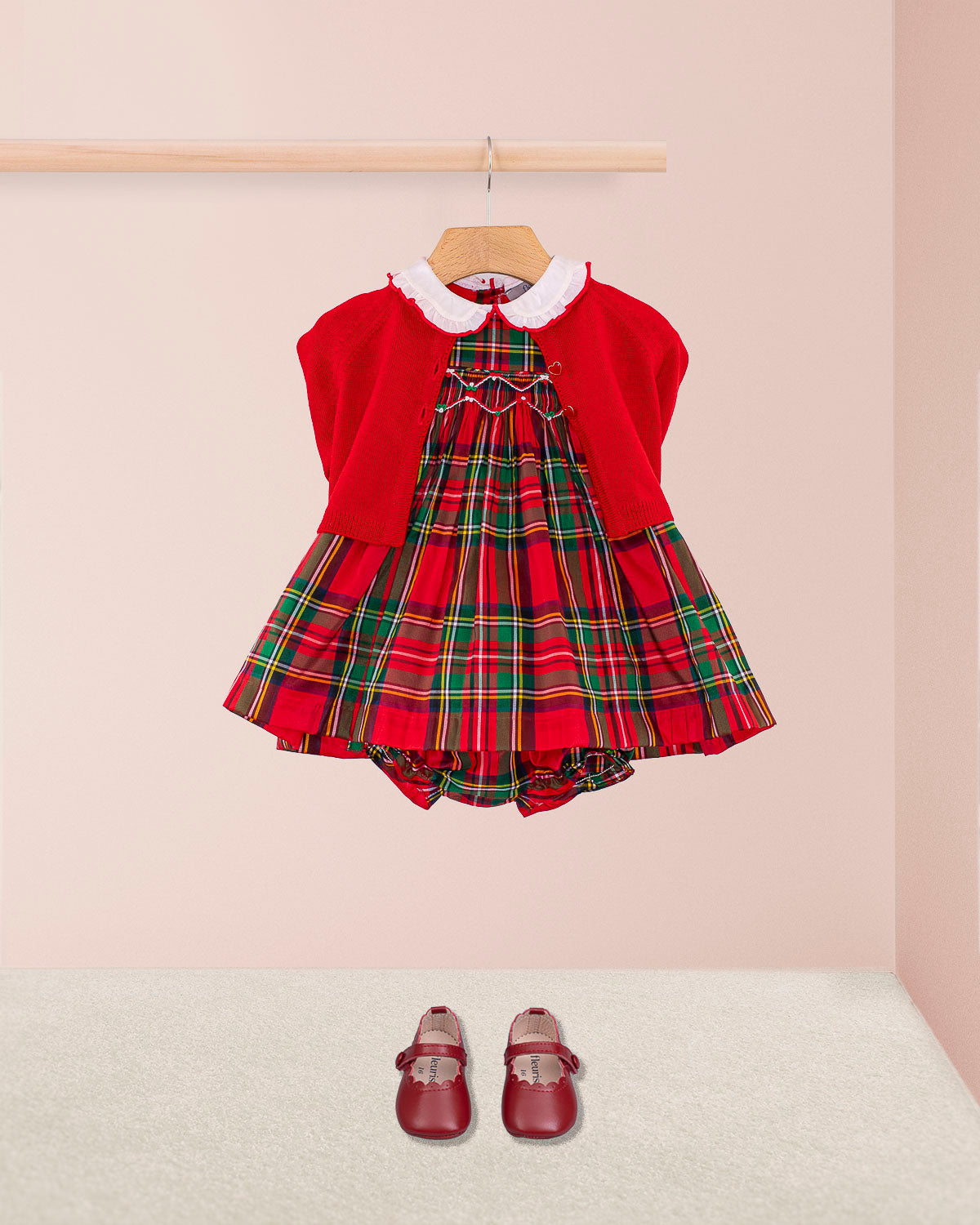Baby Holiday Royal Stewart Smock Set - Baby Dress on hanger witgh red cardigan and red shoes