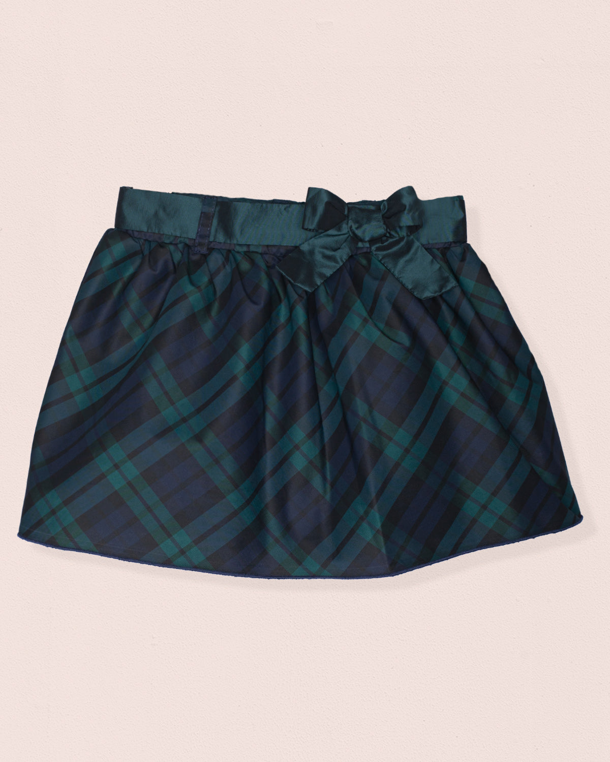 Front of a skirt with black watch plaid design, bow, with green and black color