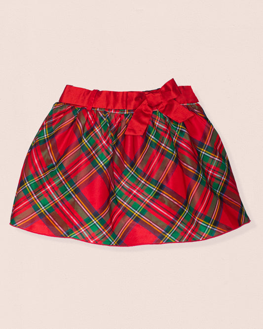 Red plaid skirt with a bow on a beige background
