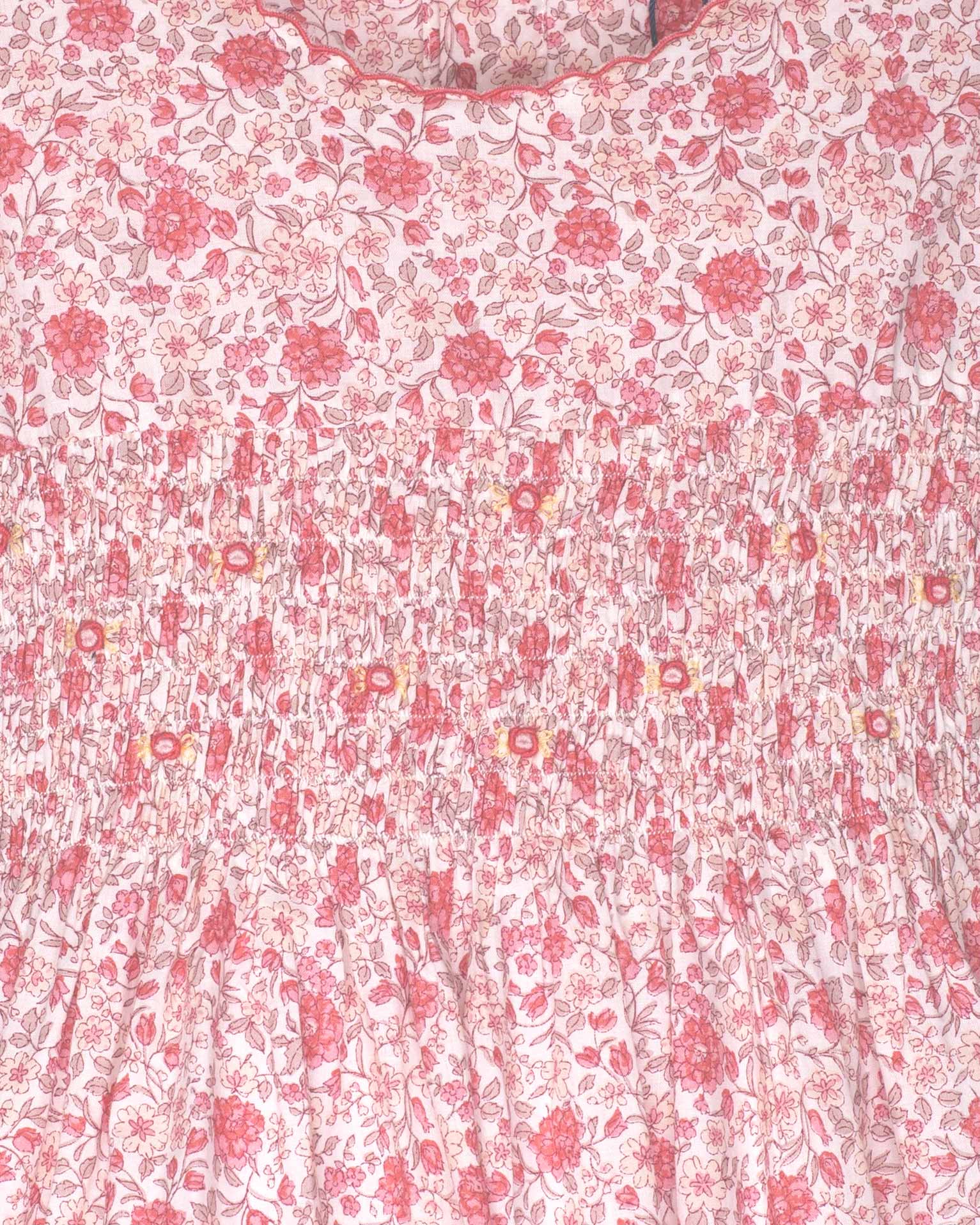 Floral patterned fabric with pink flowers on a white background