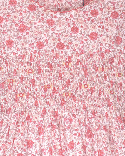 Floral patterned fabric with pink flowers on a white background