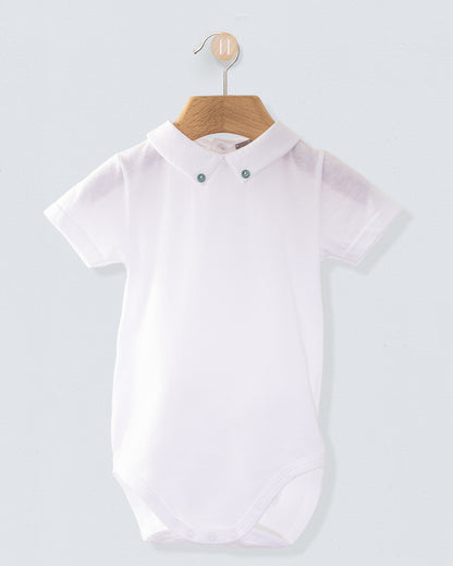 Front view of the Andreas White Onesie with Hunter Buttons, a short-sleeve white cotton jersey onesie with a crisp collar detailed with two small hunter green buttons.