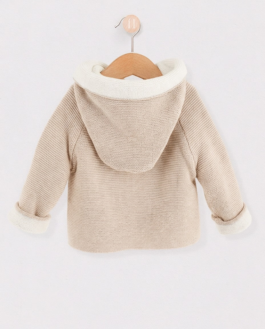 Back of beige jacket with white interior hood
