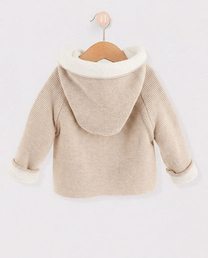 Back of beige jacket with white interior hood