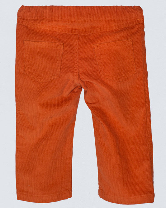 Back view of maple colored corduroy pants with an elastic waistband and two patch pockets, made from soft, fine Italian corduroy.