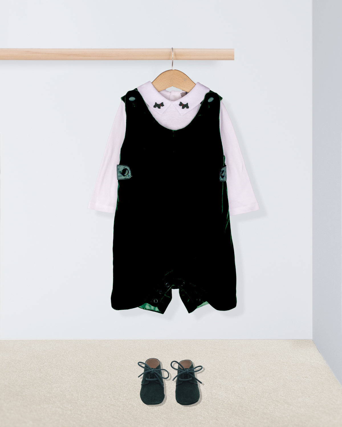 Black romper with white shirt and shoes on a white background