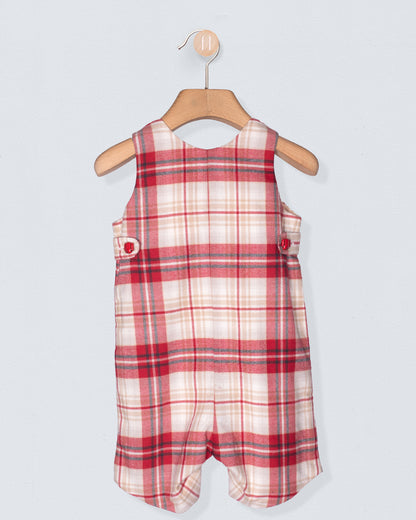 Red and white checkered romper on a hanger against a light gray background