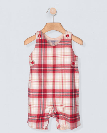 Red and white plaid baby romper on a hanger against a light gray background