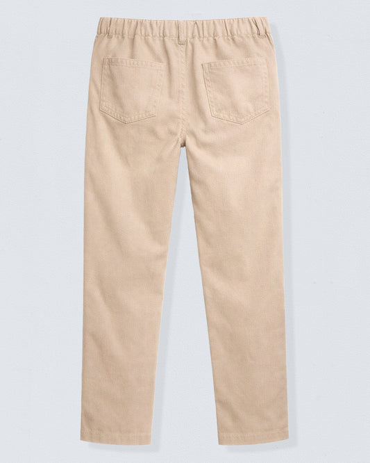 Beige pants on a light gray background