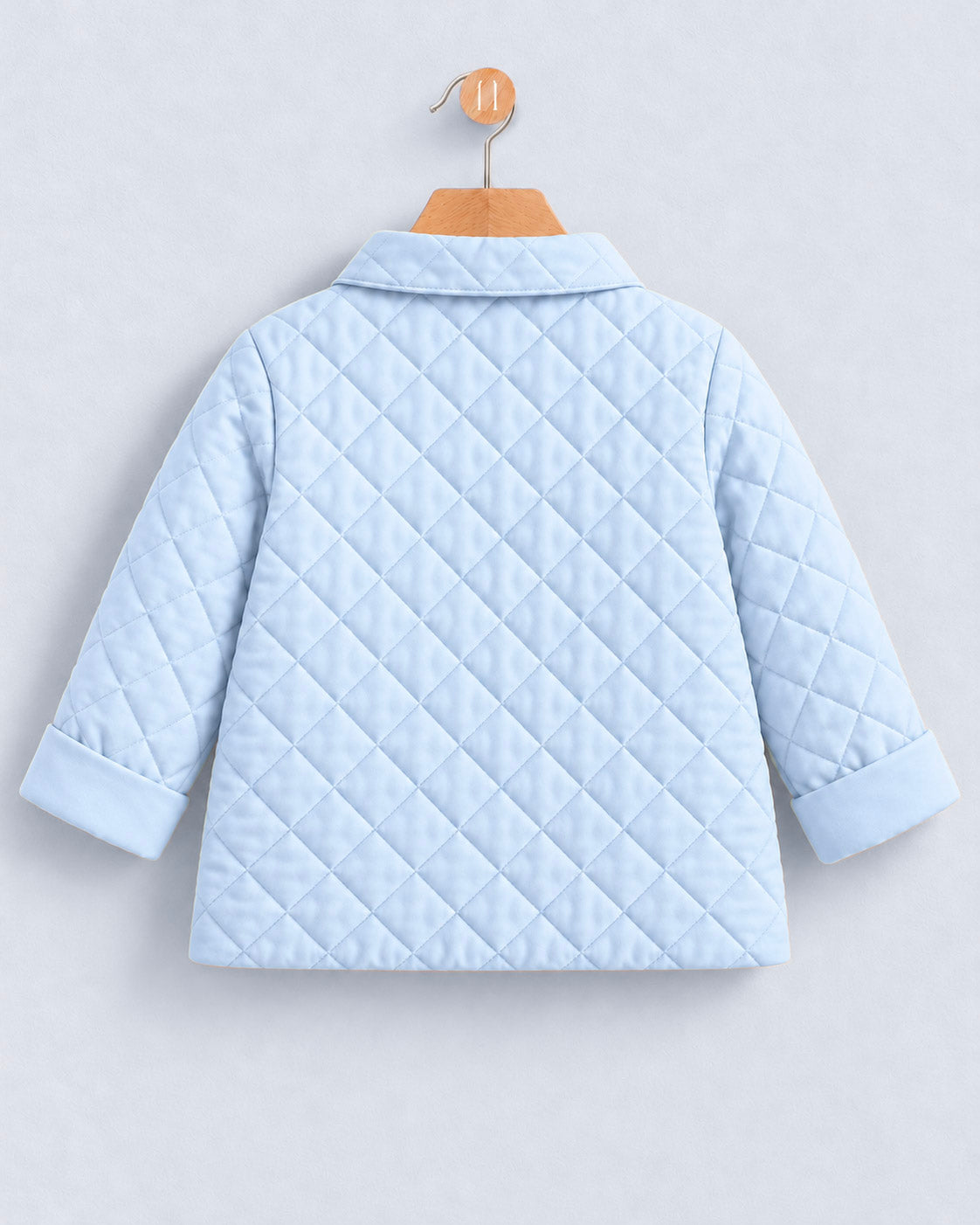 A light blue quilted jacket with a collar and three-quarter sleeves, shown from the back on a wooden hanger against a light gray background.