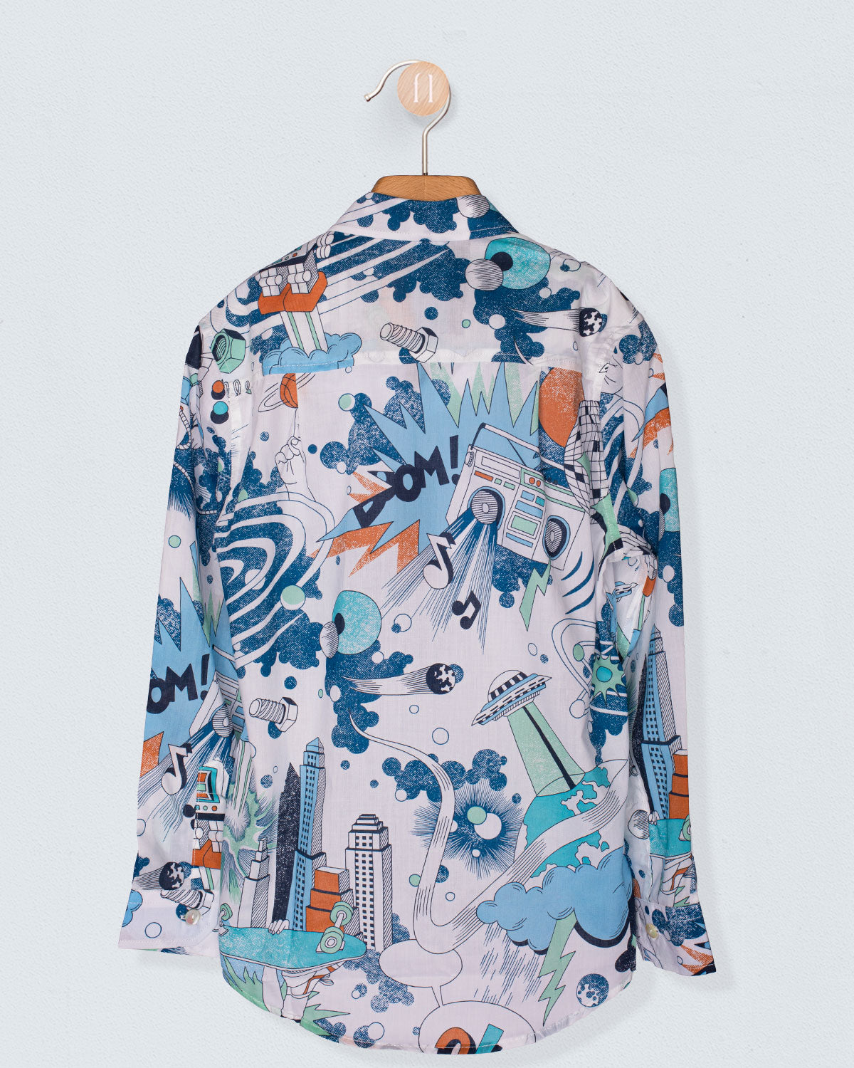 Back view of the Bernard Liberty Blue Robots Shirt displayed on a hanger. The Liberty print continues across the back with whimsical elements like boom boxes, planets, robots, and starbursts, creating a bold, colorful pattern.