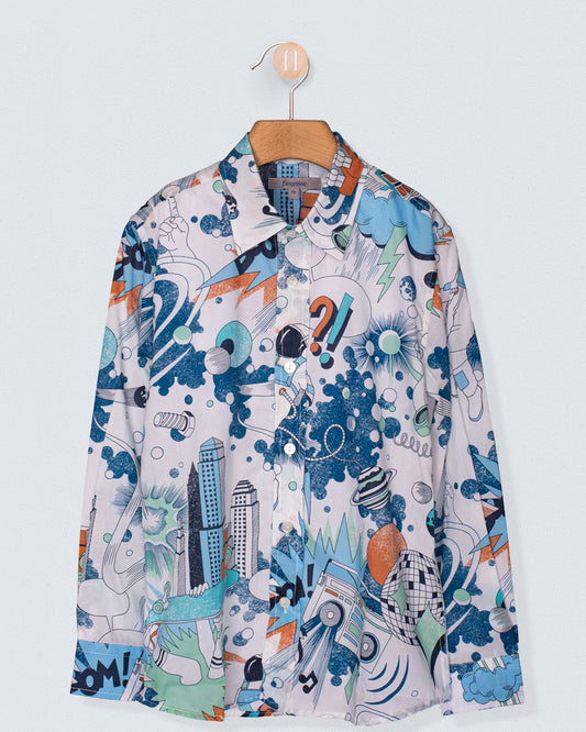 Front view of the Bernard Liberty Blue Robots Shirt hanging on a wooden hanger. The long-sleeved shirt features a playful Liberty of London print with illustrated robots, lightning bolts, satellites, cityscapes, and dynamic comic-inspired graphics in shades of blue, green, orange, and white.