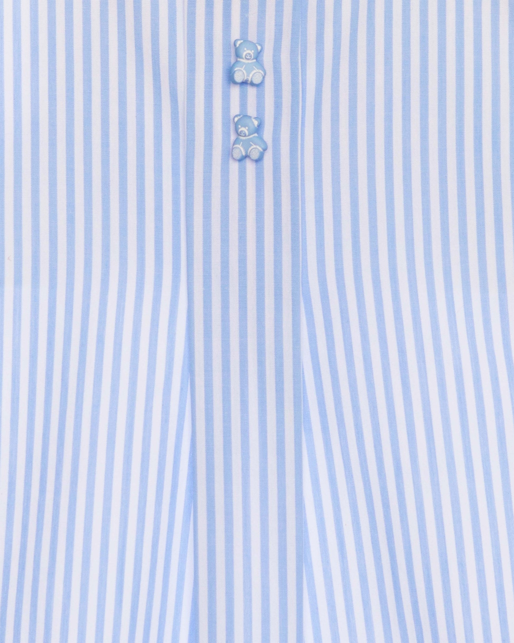 Close-up of a light blue and white striped shirt with teddy bear buttons.