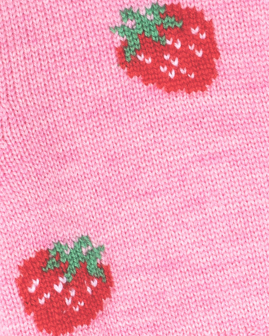 Close-up of pink fabric with red strawberry patterns