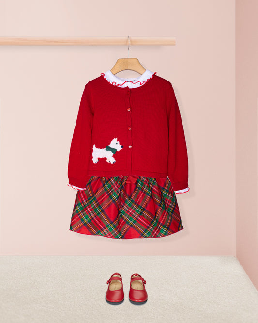 Red cardigan with embroidered dog design and shirt collar and plaid skirt and red shoes  on a pink background