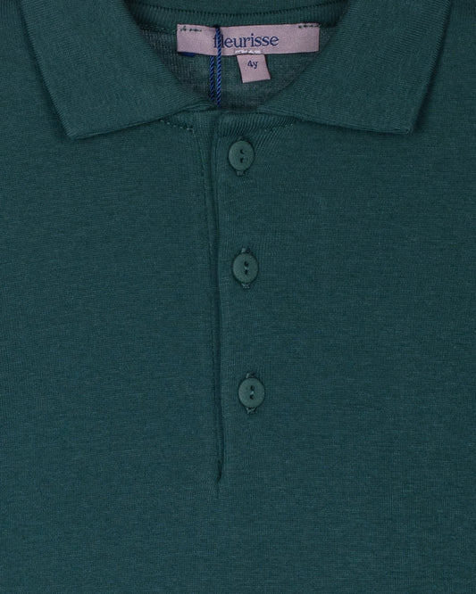 Close-up of the hunter green polo shirt showcasing the brushed cotton texture, soft point collar, and three high-quality corozo buttons on the placket.