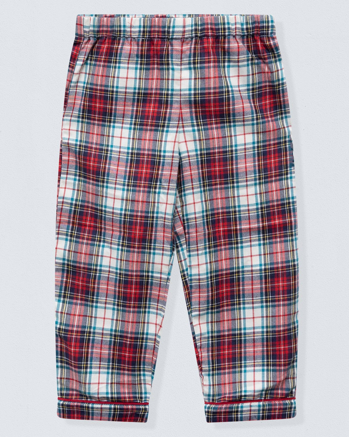 Plaid pants with red, blue, and white pattern on a light gray background